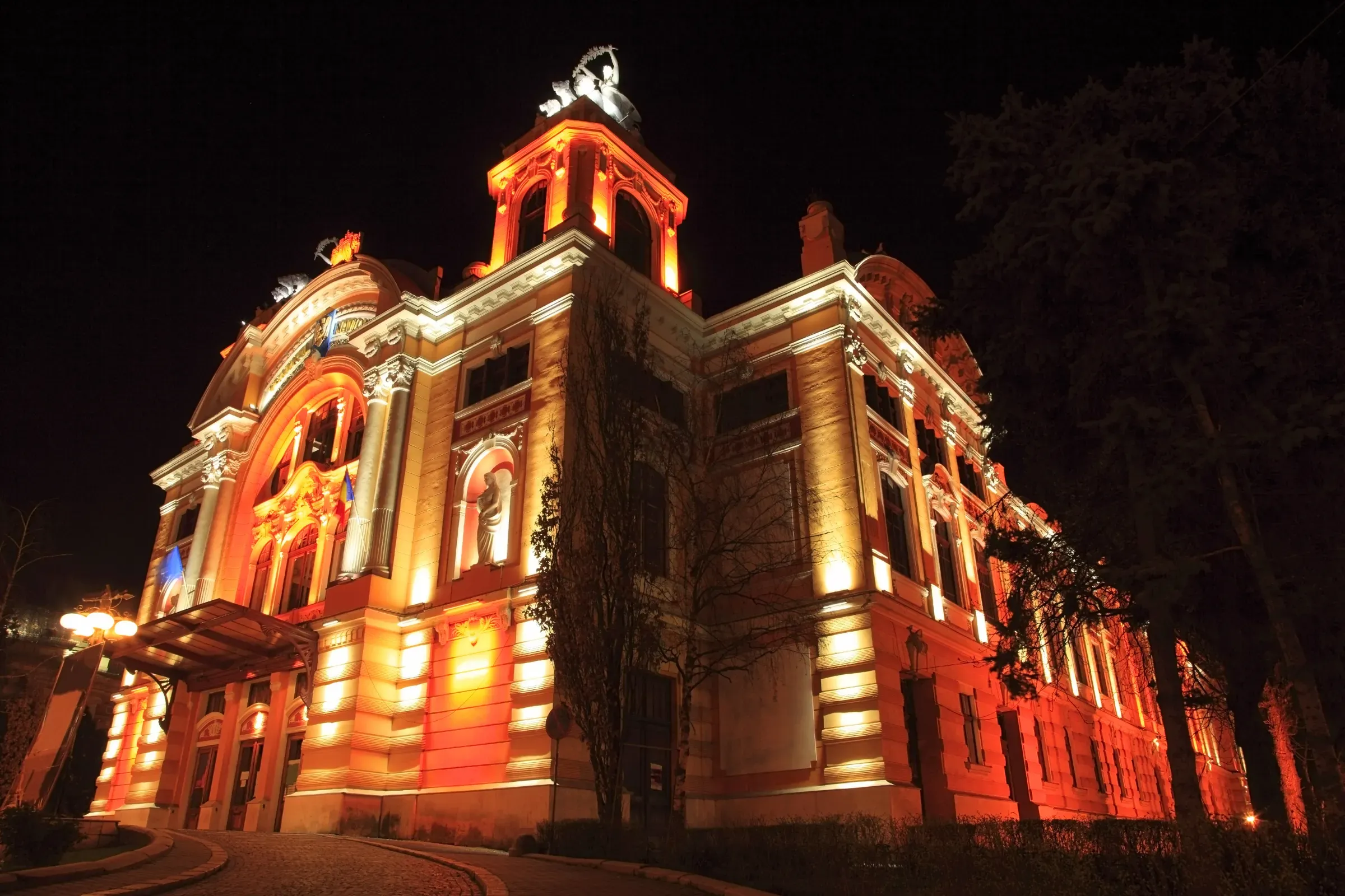 The National Theatre and Opera building on Piața Ștefan cel Mare, lit at night